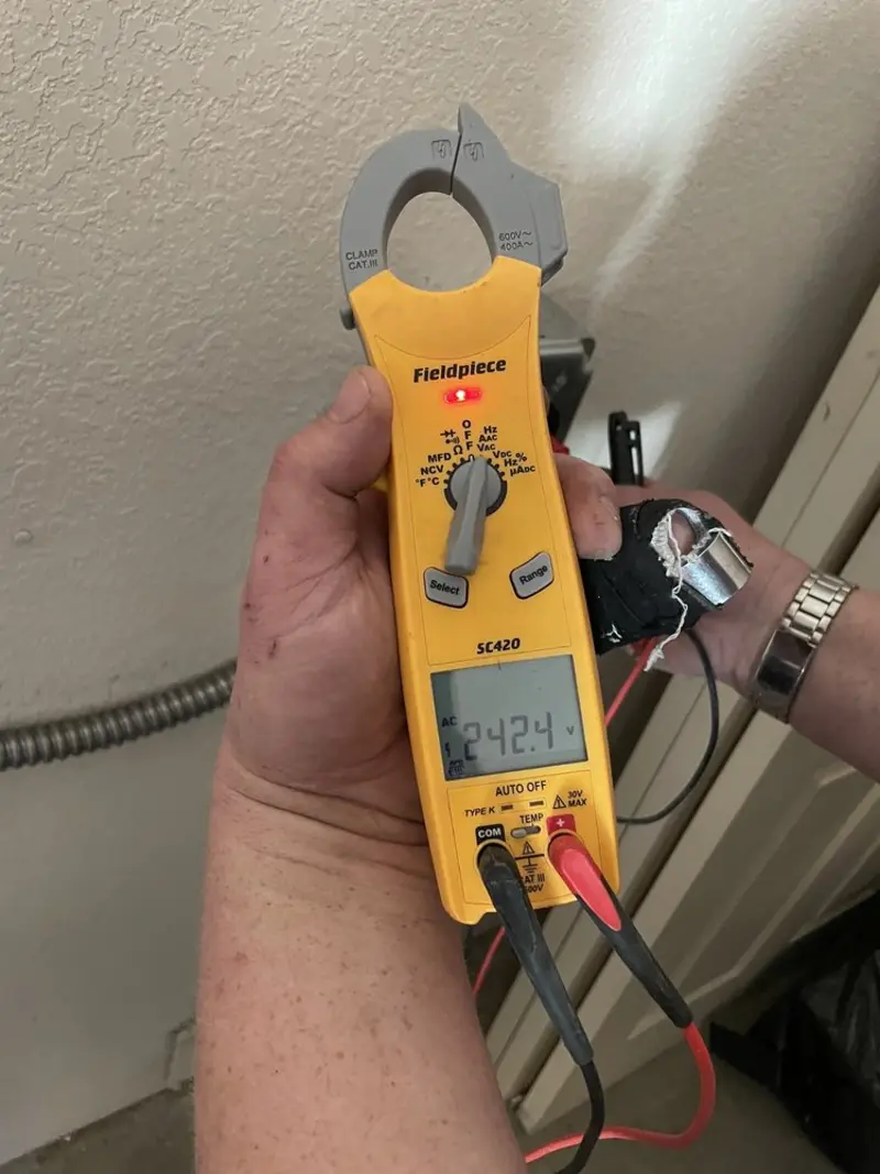 Voltage testing with clamp meter during Electrical Installation Services in Lake Alfred
